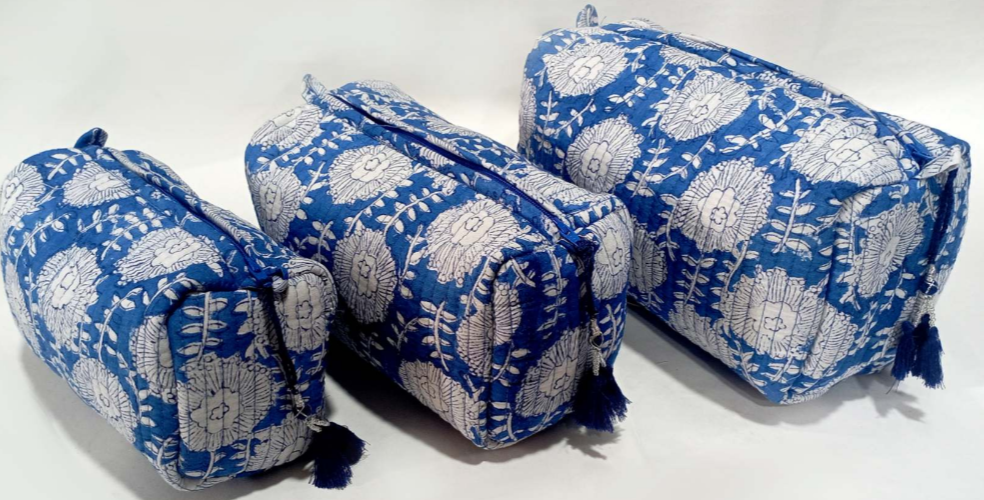 Set of three Indigo Bloom blue floral quilted wash bags with zipper closures and tassel details, perfect for travel or everyday use.
